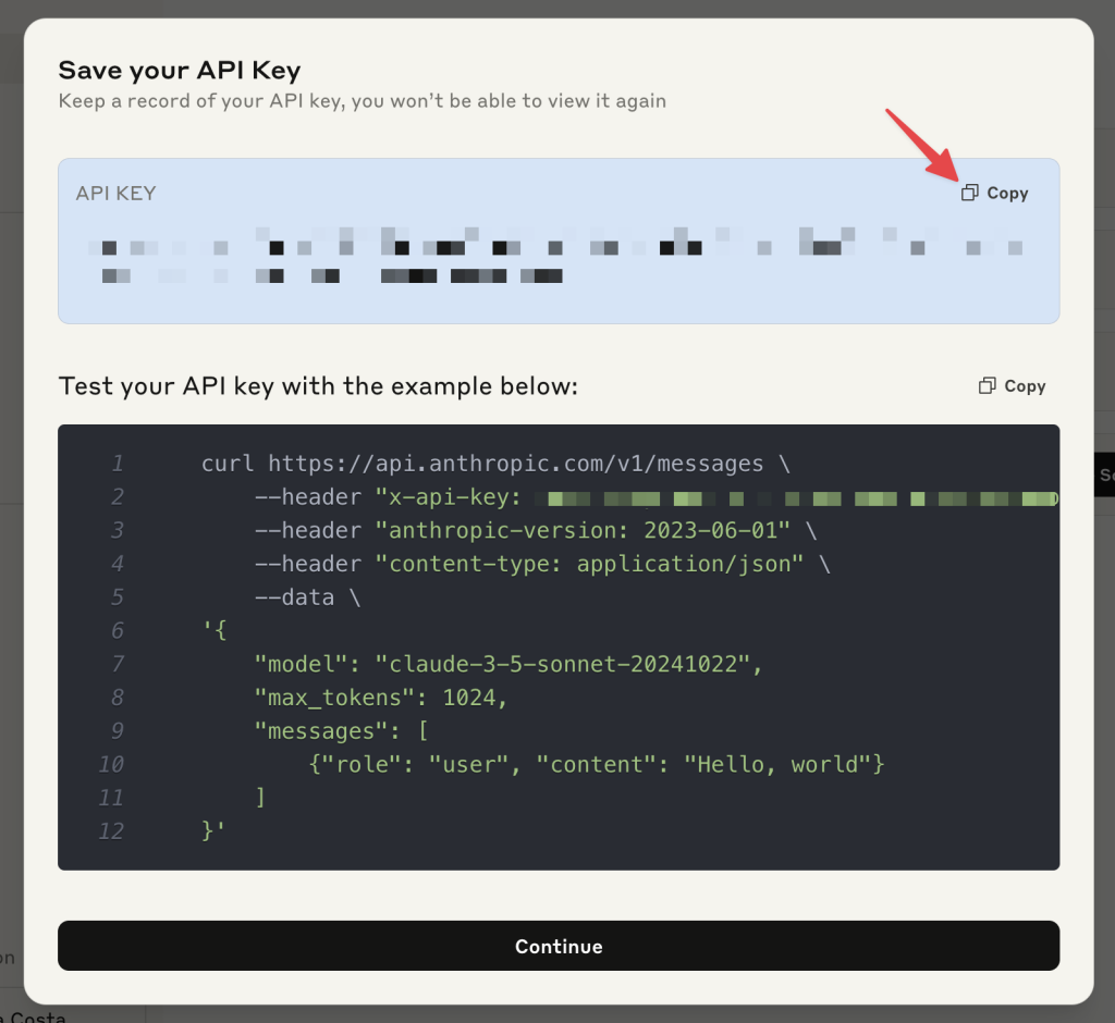 Popup window in the Anthropic Console displaying a newly generated API key with a “Copy” button.