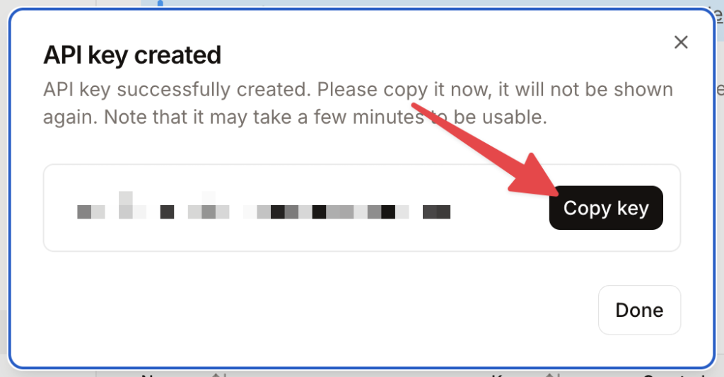Mistral AI modal for a new API key with a red arrow pointing to the “Copy key” button.